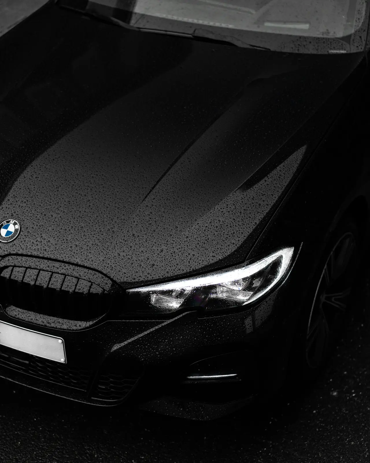 Dark performance car in the rain
